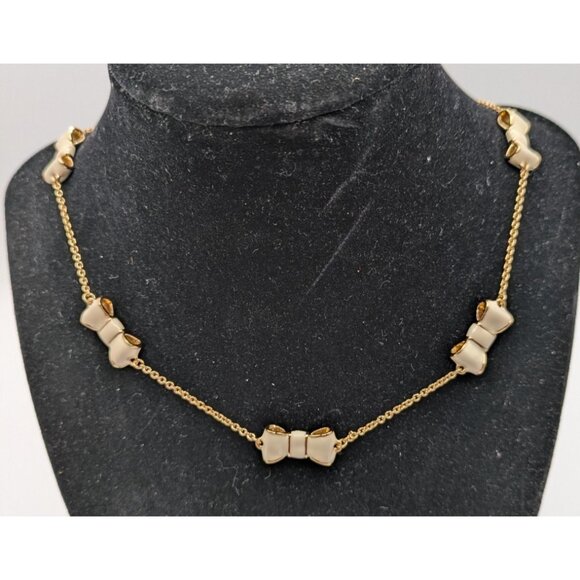 Kate Spade Take A Bow Station Necklace Cream Enamel Gold Tone Metal 32" - Picture 1 of 5
